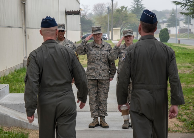 Three Team Misawa Airmen salute U.S. Air Force Col. R. Scott Jobe, left, the 35th Fighter Wing commander, and USAF Brig. Gen. Jeffrey C. Bozard, right, the 5th Air Force vice commander, at Misawa Air Base, Japan, May 2, 2018. Bozard reminded service members that building international relationships contributes to airpower capabilities and mission success. (U.S. Air Force photo by Airman 1st Class Collette Brooks)