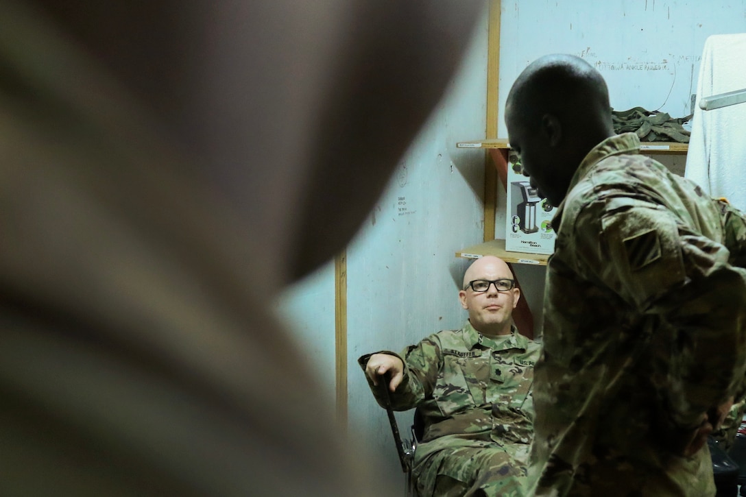 An Army medical provider discusses the status of patients during a meeting.