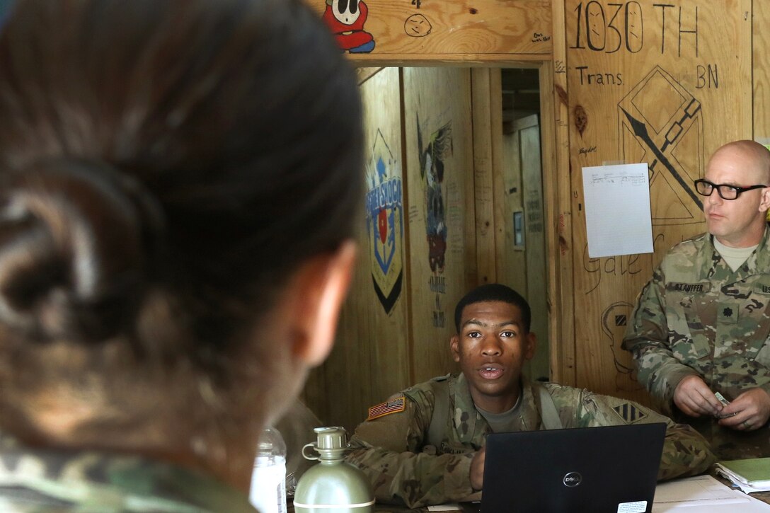 A soldier processes a patient at the brigade aid station.