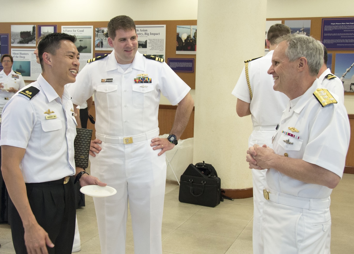 SINGAPORE (May 9, 2018) Vice Adm. Phillip G. Sawyer, commander, U.S. 7th Fleet, mingles with officers of the U.S. Navy and Republic of Singapore Navy at RSS Singapura - Changi Naval Base. U.S. 7th Fleet seeks to strengthen relationships and partnerships throughout the Indo-Pacific Region which 7th Fleet has patrolled for more than 75 years, promoting and enhancing regional security and stability.