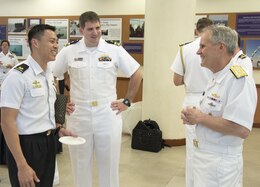 SINGAPORE (May 9, 2018) Vice Adm. Phillip G. Sawyer, commander, U.S. 7th Fleet, mingles with officers of the U.S. Navy and Republic of Singapore Navy at RSS Singapura - Changi Naval Base. U.S. 7th Fleet seeks to strengthen relationships and partnerships throughout the Indo-Pacific Region which 7th Fleet has patrolled for more than 75 years, promoting and enhancing regional security and stability.