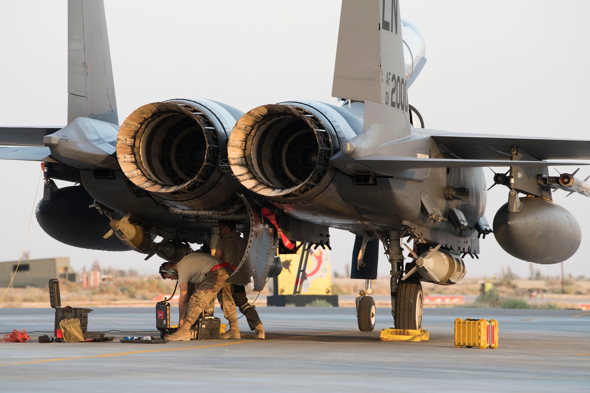 Airmen with the 332nd Expeditionary Maintenance Squadron work on an F-15E Strike Eagle April 8, 2018, at an undisclosed location in Southwest Asia.