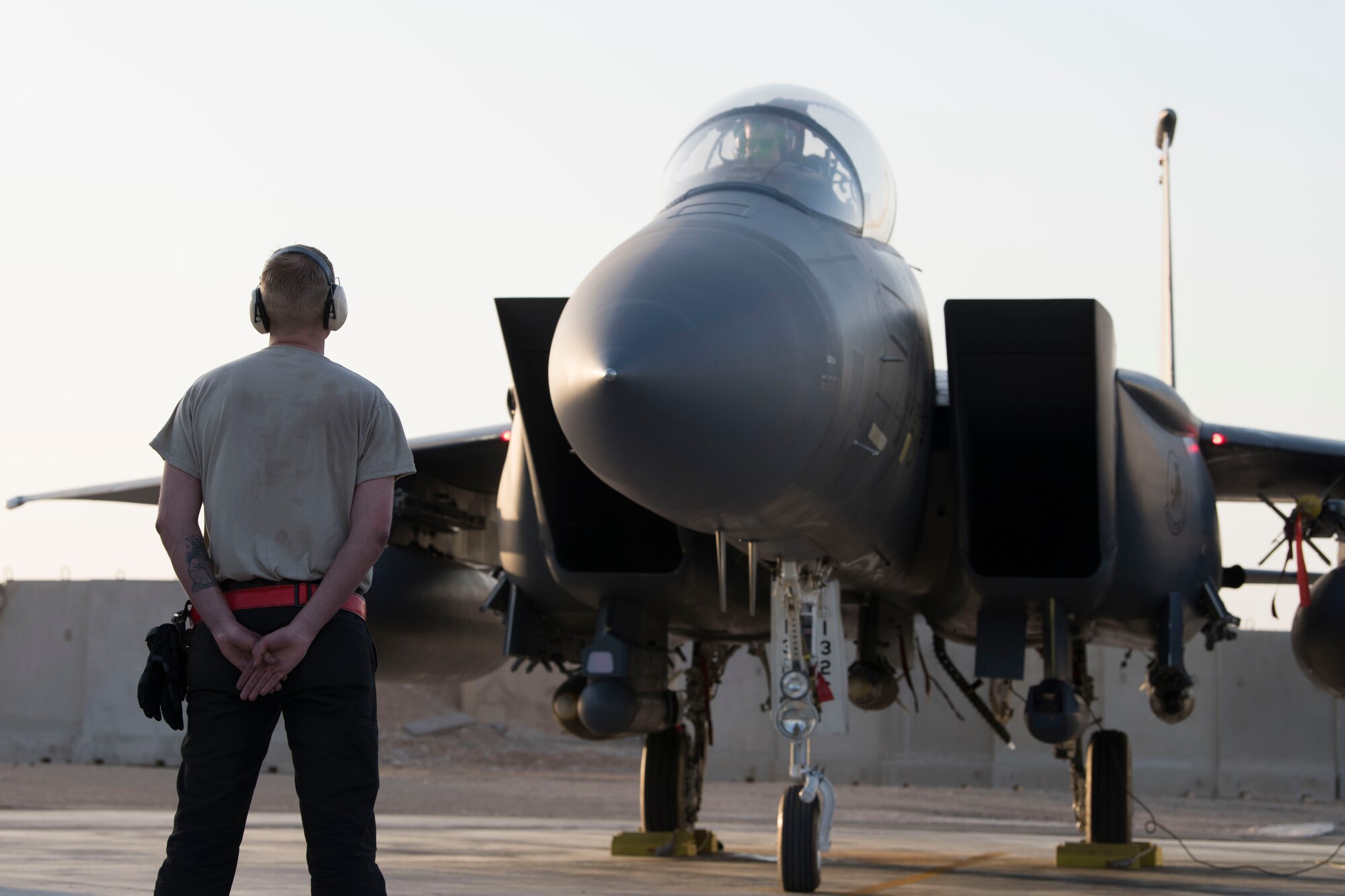 Two Airmen with the 332nd Expeditionary Maintenance Squadron work together to perform system checks on an F-15E Strike Eagle April 8, 2018, at an undisclosed location in Southwest Asia.