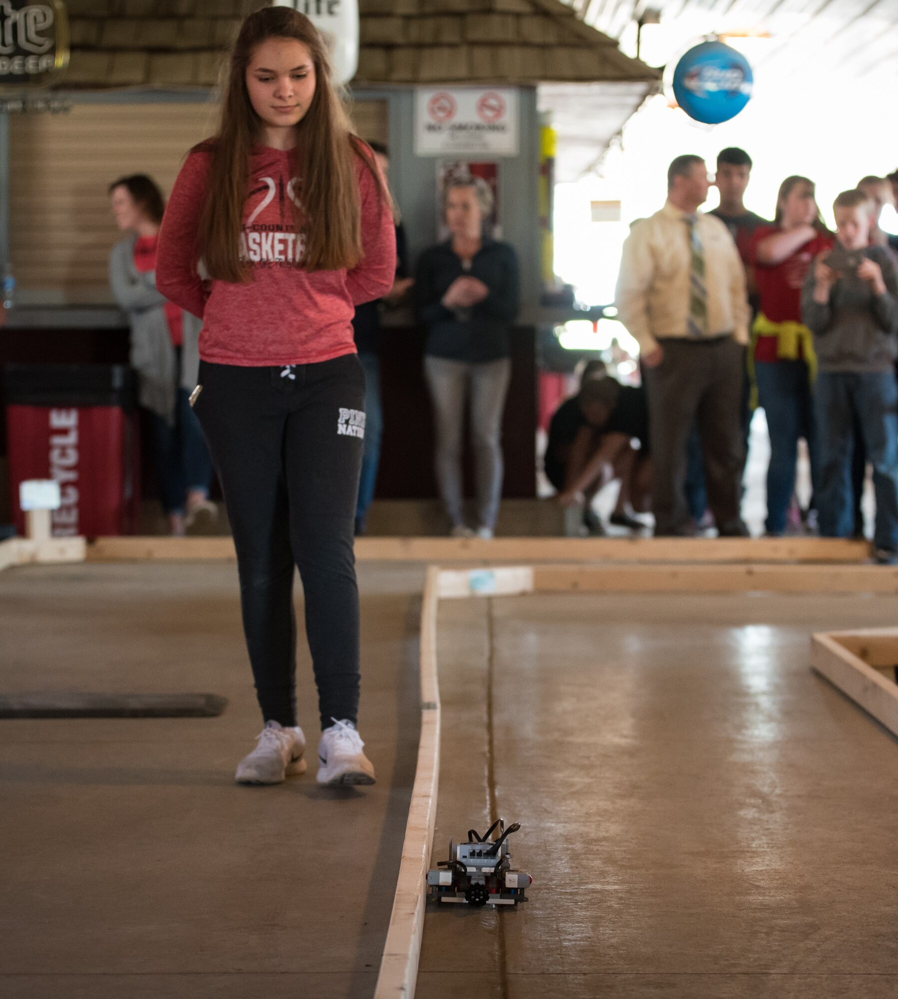 A student participates in the Autonomy Challenge with her self-driving car during the sixth annual Full-Throttle STEM® at Eldora Day in Rossburg, Ohio, May 8. Students from seven local high schools showcased their STEM-related projects, including their modeling and simulation-based work, and then competed in a remote-controlled (RC) car race at Eldora Speedway. (U.S. Air Force photo/Richard Eldridge)