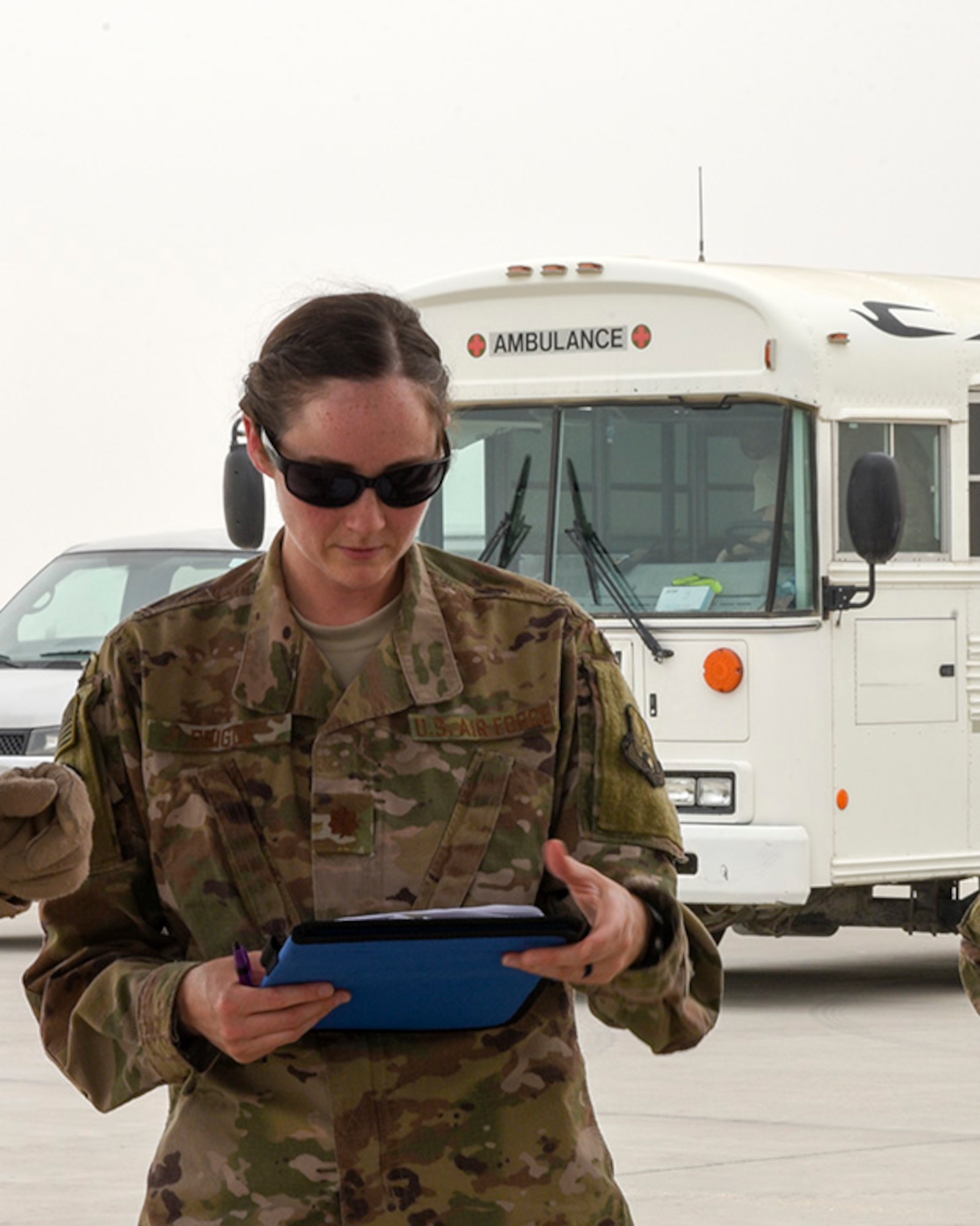 Maj. Kelly Prigge, officer in charge of the En Route Patient Staging Flight (ERPSF), reviews patient information prior to transporting the patients to a larger treatment facility at Al Udeid Air Base, Qatar on May 5, 2018. The ERPSF plays a vital role in transporting patients from various deployed location and ensuring their safe and stable transport to a facility that can support the sustained injuries. (U.S. Air Force photo by Staff Sgt. Enjoli Saunders)
