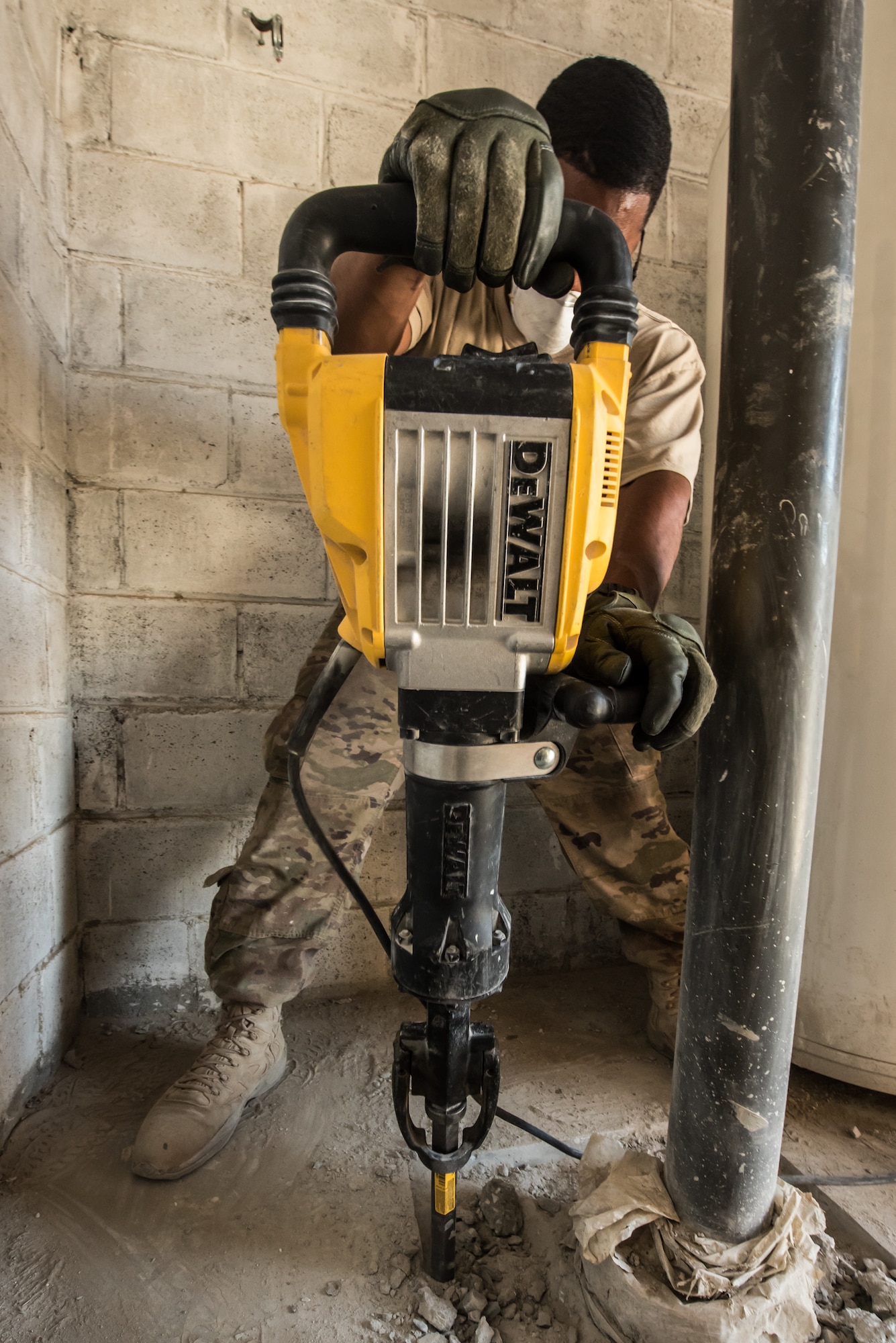 An Airman from the 1st Civil Engineer Group’s 577th Expeditionary Prime Base Engineer Emergency Force Squadron does construction work on an F-16 maintenance hangar at Bagram Airfield, Afghanistan, May 4, 2018. Separate from traditional civil engineer units, the members of the 1st ECEG perform construction and repair in high-risk environments all across the area of operations. (U.S. Air Force photo by Staff Sgt. Joshua Horton)