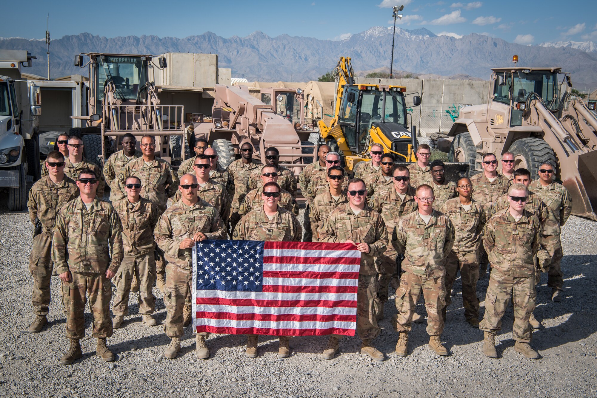 Airmen from the 1st Civil Engineer Group’s 577th Expeditionary Prime Base Engineer Emergency Force Squadron pose for a group photo at Bagram Airfield, Afghanistan, May 4, 2018. Separate from traditional civil engineer units, the members of the 1st ECEG perform construction and repair in high-risk environments all across the area of operations. (U.S. Air Force photo by Staff Sgt. Joshua Horton)