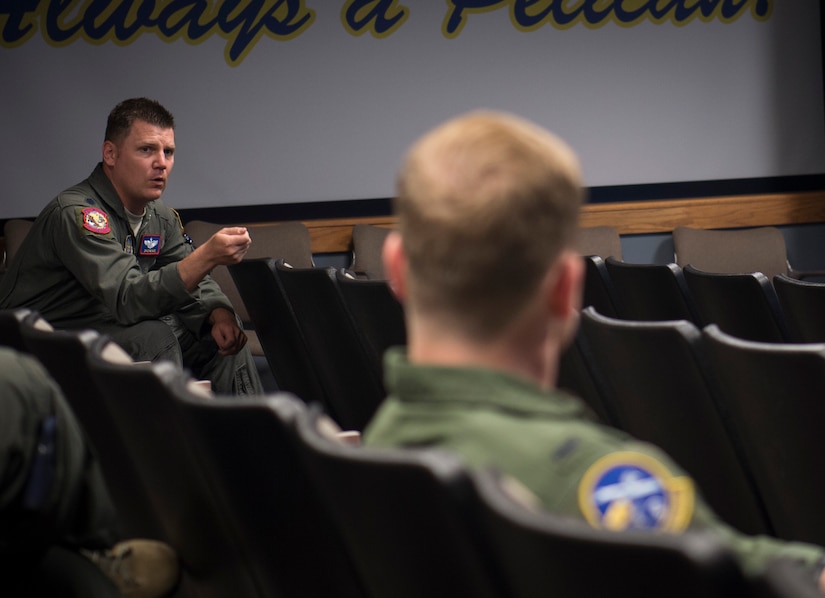 Lt. Col. David Shur, 15th Airlift Squadron director of operations, speaks to Joint Base Charleston pilots during a briefing by T-1A Jayhawk and T-6A Texan II jet trainer aircraft instructors from Columbus Air Force Base, Miss. at the 14th Airlift Squadron on Joint Base Charleston, S.C., May 7, 2018.