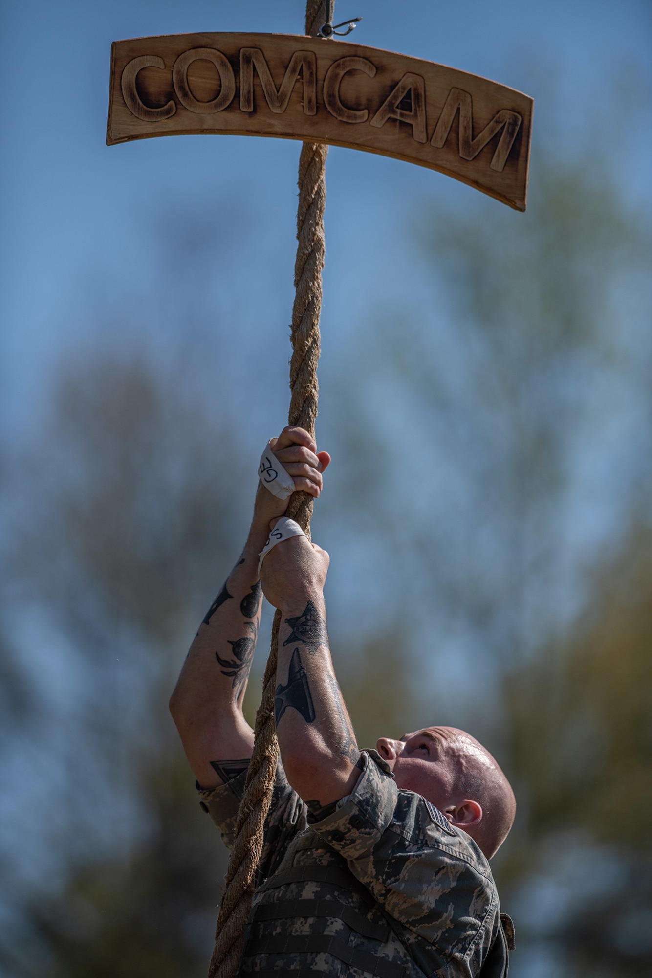 Staff Sgt. Corban Lundborg, assigned to 4th Combat Camera Squadron, climbs a rope during the obstacle course portion of the 2018 SPC Hilda I. Clayton Best Combat Camera Competition at Marine Corps Base Quantico, Va., May 1, 2018. The competition is an annual event open to all branches of the military, it’s hosted by the 55th Signal Company (Combat Camera) in order to test the technical and tactical proficiencies of Defense Department combat photographers. (U.S. Army photo by Staff Sgt. Pablo N. Piedra)