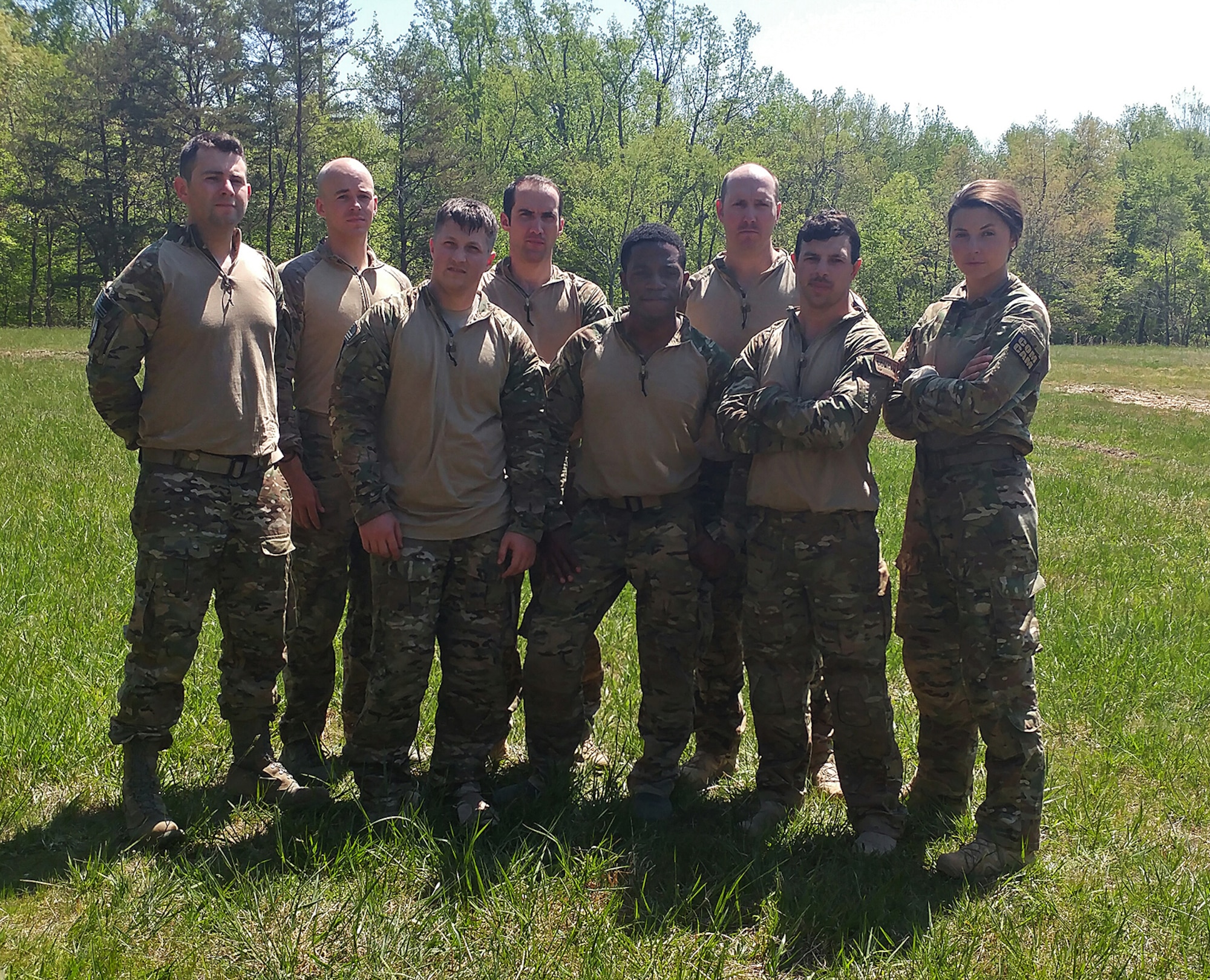 Airmen from the 1st Combat Camera Squadron and 4th Combat Camera Squadron, pose for a photo following the completion of a 10-mile road march at the 2018 SPC Hilda I. Clayton Best Combat Camera Competition at Marine Corps Base Quantico, Va., May 3, 2018. The competition is an annual event open to all branches of the military, it's hosted by the 55th Signal Company (Combat Camera) in order to test the technical and tactical proficiencies of Defense Department combat photographers. (U.S. Air Force photo by Maj. Zach Anderson)