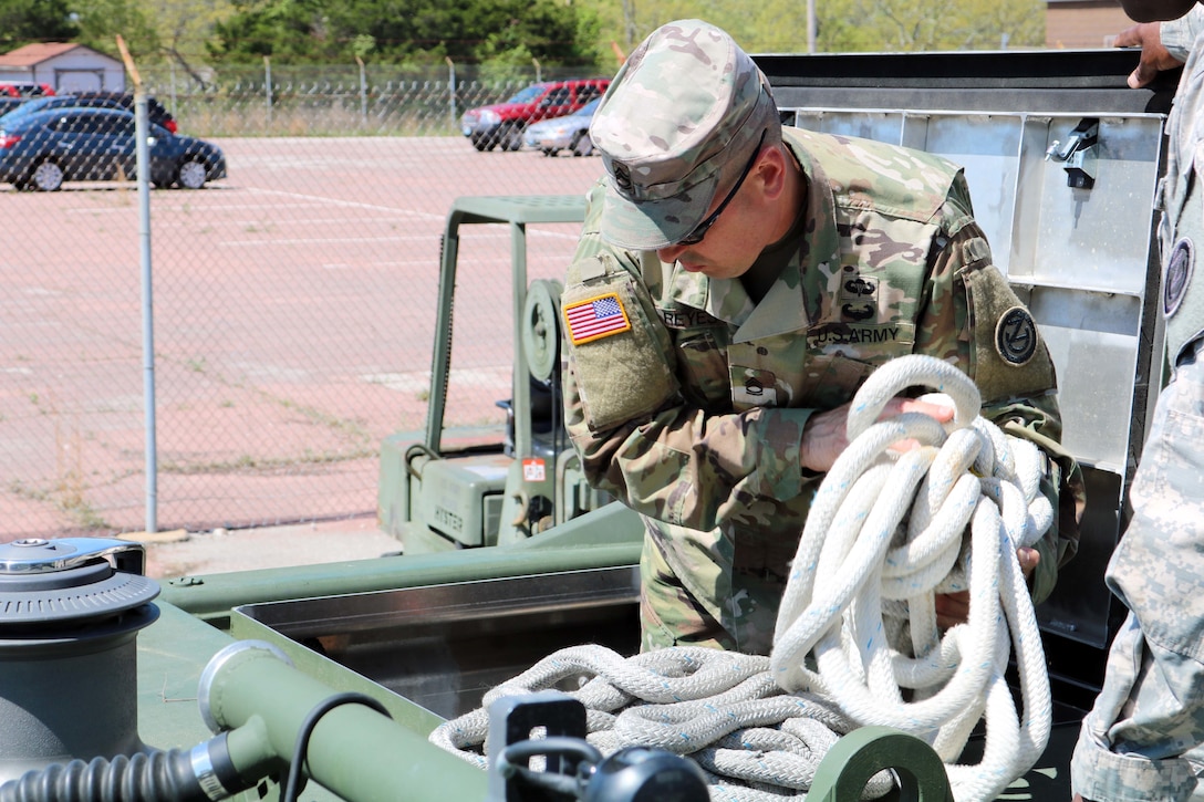 Sgt. 1st Class John Reyes, 102d Training Division (MS) 12C instructor, goes over the M30 Bridge Erection Boat during training on the new equipment at Fort Leonard Wood, Mo.