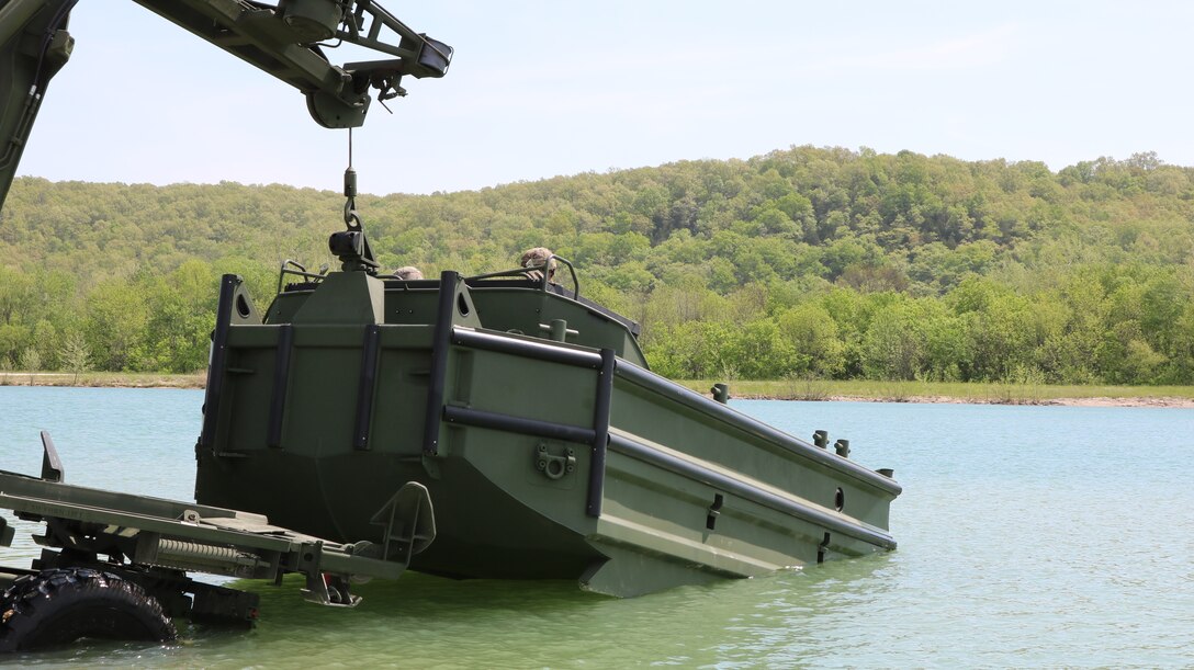 The M30 Bridge Erection Boat is launched into the water during  new equipment operator training at Fort Leonard Wood, Mo.