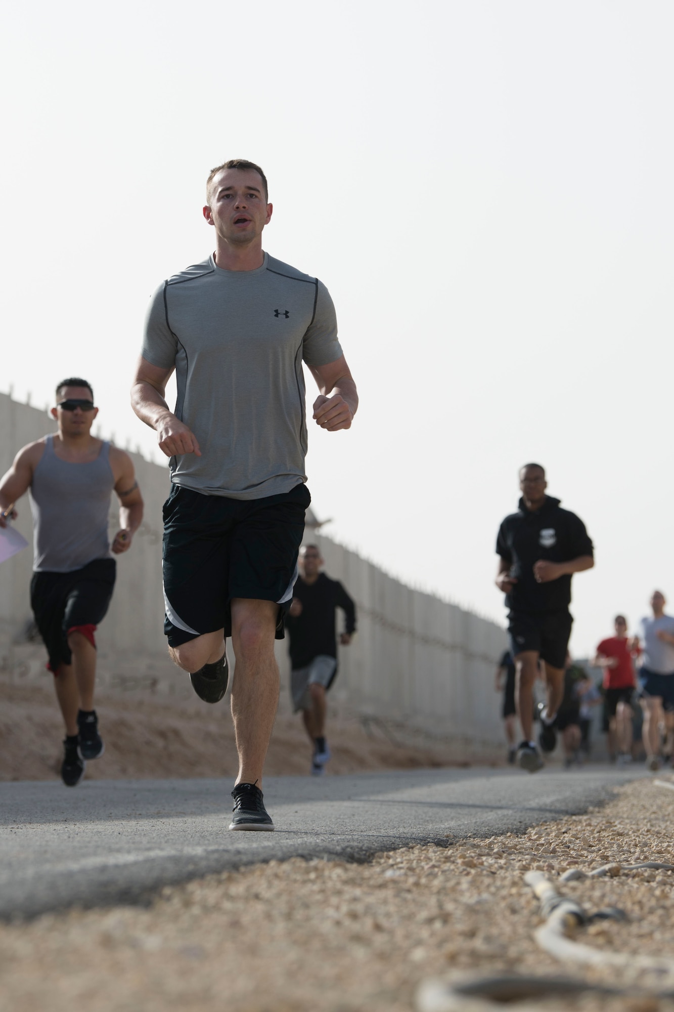 Airmen with the 332nd Air Expeditionary Wing run during the Commander’s Challenge, which the Sexual Assault Prevention and Response office hosted at an undisclosed location in Southwest Asia May 4, 2018.
