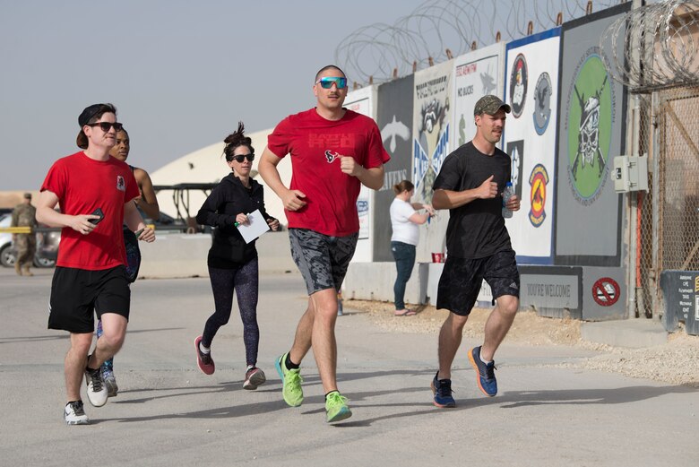 Airmen with the 332nd Air Expeditionary Wing attempt to locate the next helping agency they must find during the Commander’s Challenge, which the Sexual Assault Prevention and Response office hosted at an undisclosed location in Southwest Asia May 4, 2018.