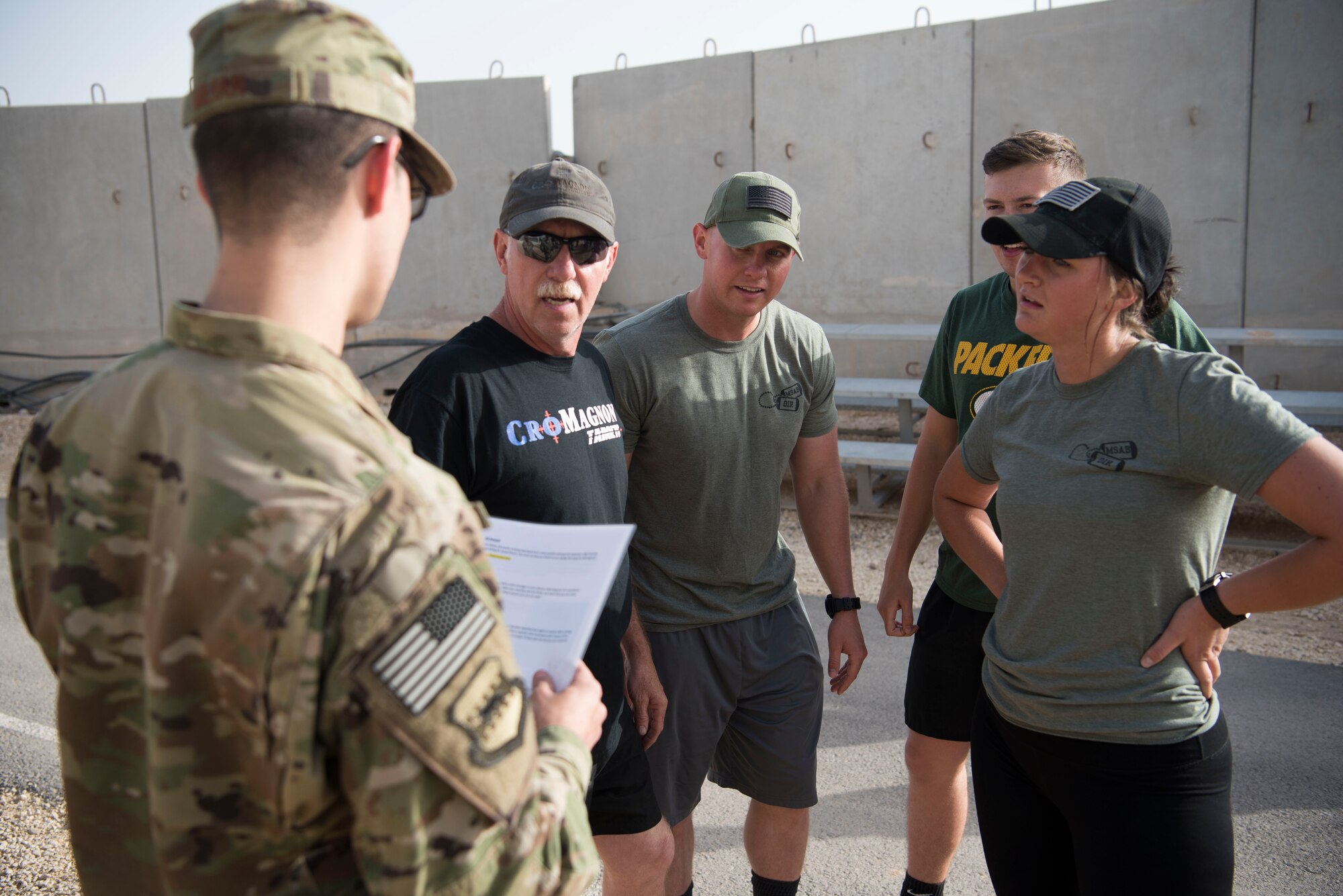 Airmen listen to a scenario question during the Commander’s Challenge, which the Sexual Assault Prevention and Response office hosted at an undisclosed location in Southwest Asia May 4, 2018.