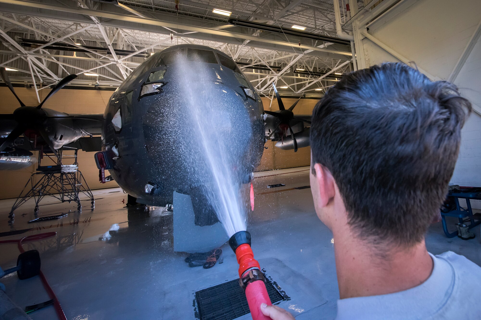 Senior Airmen Aaron Brewer, 71st Aircraft Maintenance Unit (AMU) crew chief, uses a power washer to clean an HC-130J Combat King II, May 7, 2018, at Moody Air Force Base, Ga. Upon return from a deployment or every 180 days, HC-130’s are thoroughly cleaned and inspected as part of routine upkeep and to ensure its respective components are in working condition. (U.S. Air Force photo by Airman 1st Class Eugene Oliver)