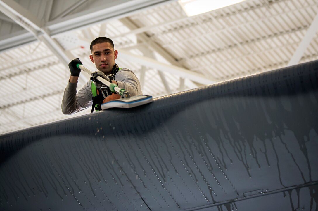 Airman 1st Class Jesse Orosco, 71st Aircraft Maintenance Unit (AMU) crew chief, uses a magic eraser to clean the tail fin of an HC-130J Combat King II, May 7, 2018, at Moody Air Force Base, Ga. Upon return from a deployment or every 180 days, HC-130’s are thoroughly cleaned and inspected as part of routine upkeep and to ensure its respective components are in working condition. (U.S. Air Force photo by Airman 1st Class Eugene Oliver)