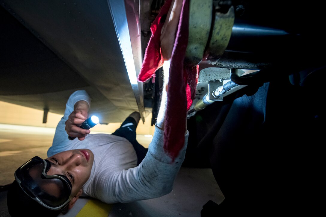 Airman 1st Class Jesse Orosco, 71st Aircraft Maintenance Unit (AMU) crew chief, uses a rag to clean the internal component to the landing gear of an HC-130J Combat King II, May 8, 2018, at Moody Air Force Base, Ga. Upon return from a deployment or every 180 days, HC-130’s are thoroughly cleaned and inspected as part of routine upkeep and to ensure its respective components are in working condition. (U.S. Air Force photo by Airman 1st Class Eugene Oliver)