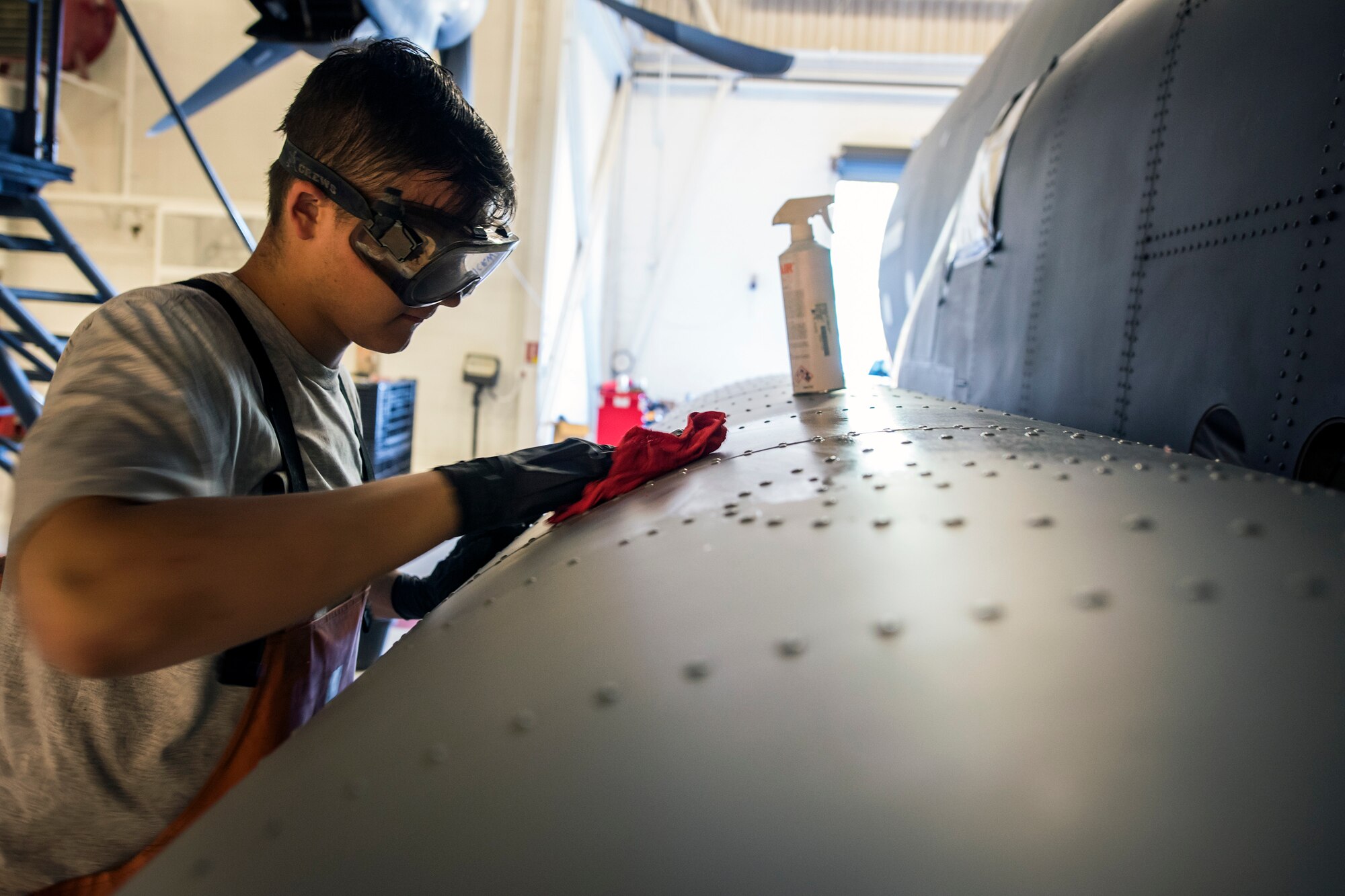 Airman 1st Class Austin Maddock, 71st Aircraft Maintenance Unit (AMU) integrated flight and control systems journeyman, wipes lubricant on the wheel cover of an HC-130J Combat King II, May 8, 2018, at Moody Air Force Base, Ga. Upon return from a deployment or every 180 days, HC-130’s are thoroughly cleaned and inspected as part of routine upkeep and to ensure its respective components are in working condition. (U.S. Air Force photo by Airman 1st Class Eugene Oliver)