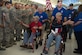 Veterans shake the hands of Airmen and supporters while being pushed by Honor Flight San Antonio volunteer "Guardians" May 5, 2018 .