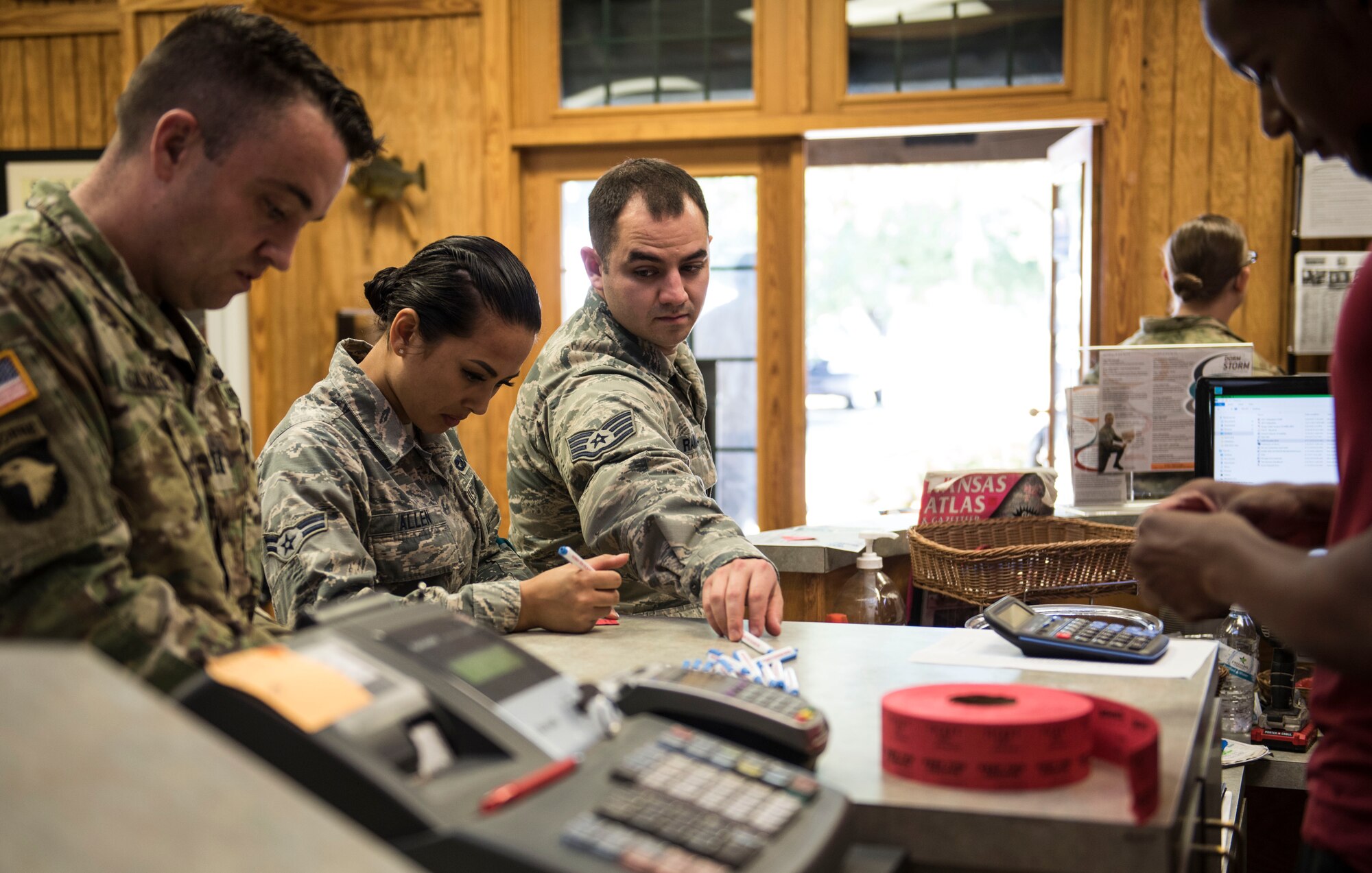 Team Shaw members fill out raffle tickets during an Outdoor Recreation open house at Shaw Air Force Base, S.C., May 9, 2018.