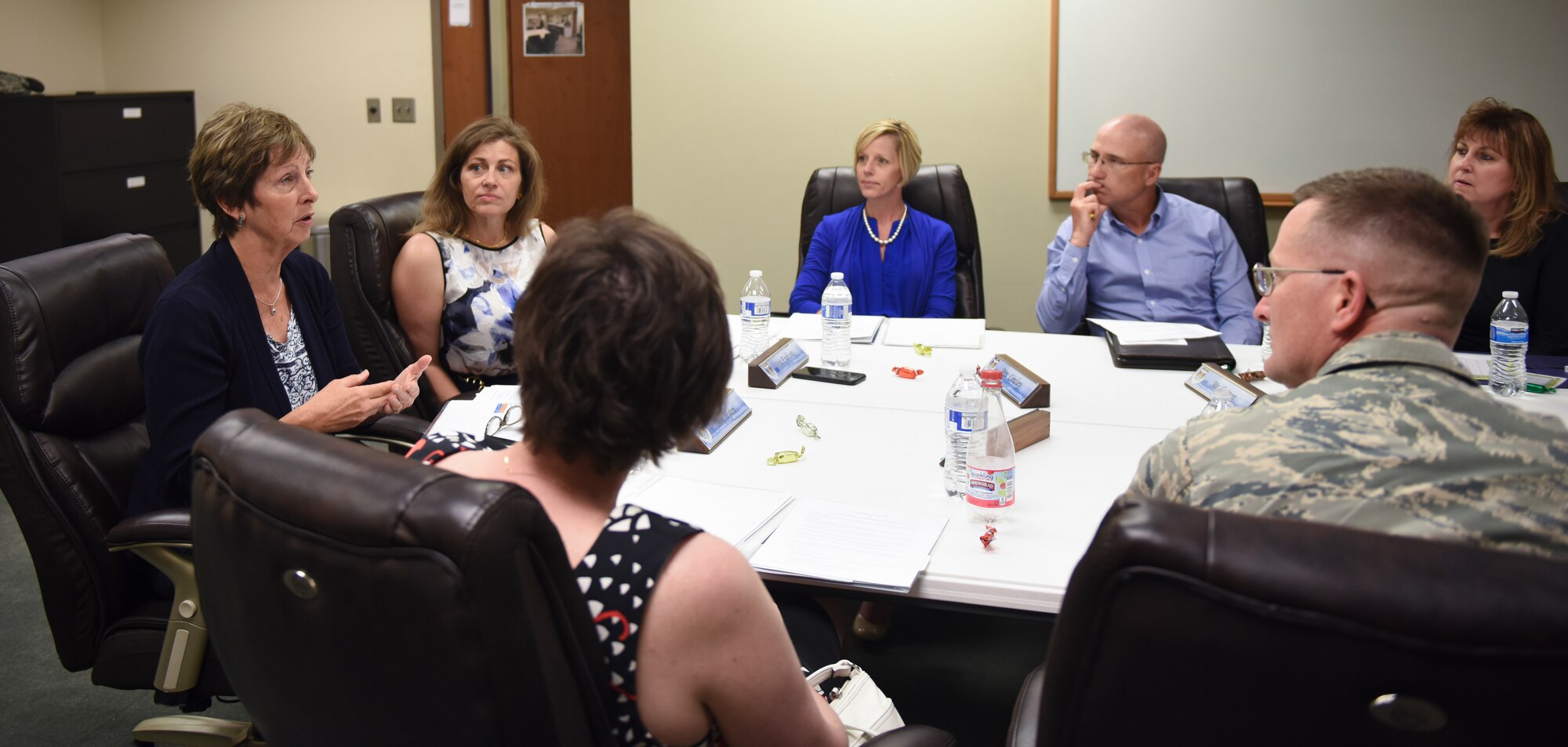 Lauren Hyten, spouse of Gen. John E. Hyten, U.S. Strategic Command commander, explains the importance of all helping agency programs at the base chapel May 9, 2018 on Buckley Air Force Base, Colorado. Program managers that attended the meeting represented Providing for Providers, the Key Spouse program, Continuum of Care and the Allied Family Integration Program. (U.S. Air Force photo by Airman 1st Class Michael D. Mathews)
