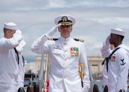 180413-N-LY160-0342 PEARL HARBOR (April 13, 2018) - Cmdr. Heath E. Johnmeyer, commanding officer of the Virginia-class fast-attack submarine USS Mississippi (SSN 782) is piped ashore following a change of command ceremony on the submarine piers in Joint Base Pearl Harbor-Hickam, May 8. Johnmeyer relieved Cmdr. Eric J. Rozek. (U.S. Navy photo by Mass Communication Specialist 2nd Class Michael Lee/Released)