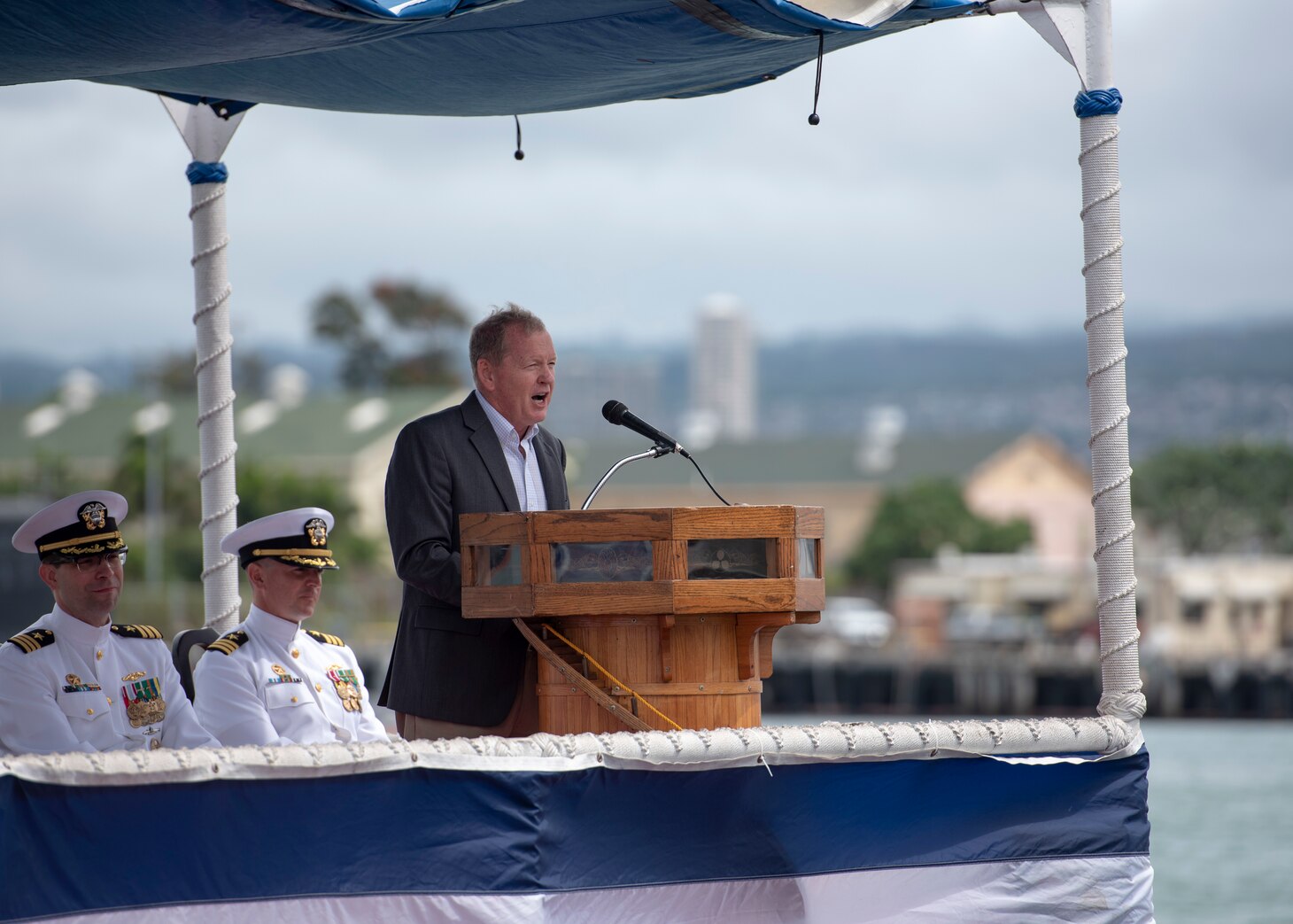 180508-N-LY160-0080 PEARL HARBOR (May 8, 2018) - Rear Adm. (ret.) Barry L. Bruner addresses guests during the Virginia-class fast-attack submarine USS Mississippi (SSN 782) change of command ceremony on the submarine piers in Joint Base Pearl Harbor-Hickam, May 8. Cmdr. Heath E. Johnmeyer relieved Cmdr. Eric J. Rozek as Mississippi’s commanding officer. (U.S. Navy photo by Mass Communication Specialist 2nd Class Michael Lee/Released)