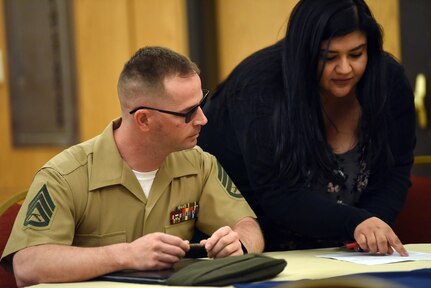 Staff Sgt. David Dean from Battalion West participates in a resume review and practice interview during the Department of the Navy's Veteran and Wounded Warrior Hiring & Support Summit