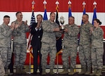 U.S. Air Force Brig. Gen. John Nichols, the 509th Bomb Wing commander, center left, and Col. Ken Eaves, the 131st Bomb Wing commander, display the Omaha Trophy at Whiteman Air Force Base, Mo., May 8, 2018. The award was awarded to Team Whiteman by U.S. Strategic Command and the Strategic Command Council for executing the best Strategic Bomber Operations of 2017. (U.S. Air Force photos by Senior Airman Jovan Banks)