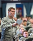 U.S. Air Force Col. John Klein, 60th Air Mobility Wing commander, addresses members of the 60th AMW during a commander's call at Travis Air Force Base, Calif., May 8, 2018. Klein is conducting his last commander’s calls as the commander of the 60th AMW before departing in July. (U.S. Air Force photo by Louis Briscese)