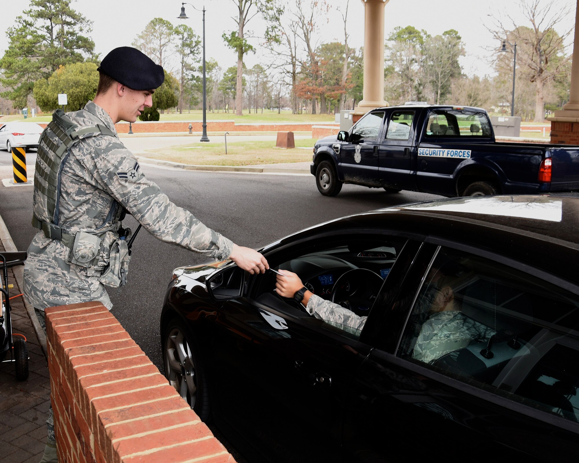Airman 1st Class Jacob Lightsey, 14th Security Forces Squadron patrolman, checks a military ID Feb. 16, 2017, on Columbus Air Force Base, Mississippi. Security Forces defenders are the front line for protecting Airmen, their families and Air Force resources from harm. (U.S. Air Force photo by Elizabeth Owens)