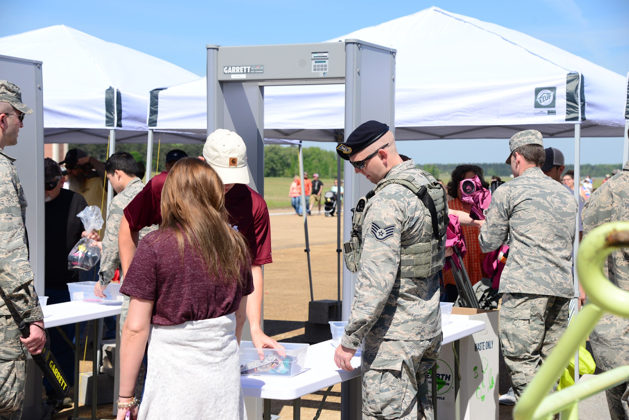 Defenders and trained augmentees with the 14th Security Forces Squadron scan and search 2018 Wings Over Columbus Air and Space Show attendees April 21, 2018, on Columbus Air Force Base, Mississippi. Security forces were responsible for approximately 21,000 people. (U.S. Air Force photo by Airman 1st Class Beaux Hebert)