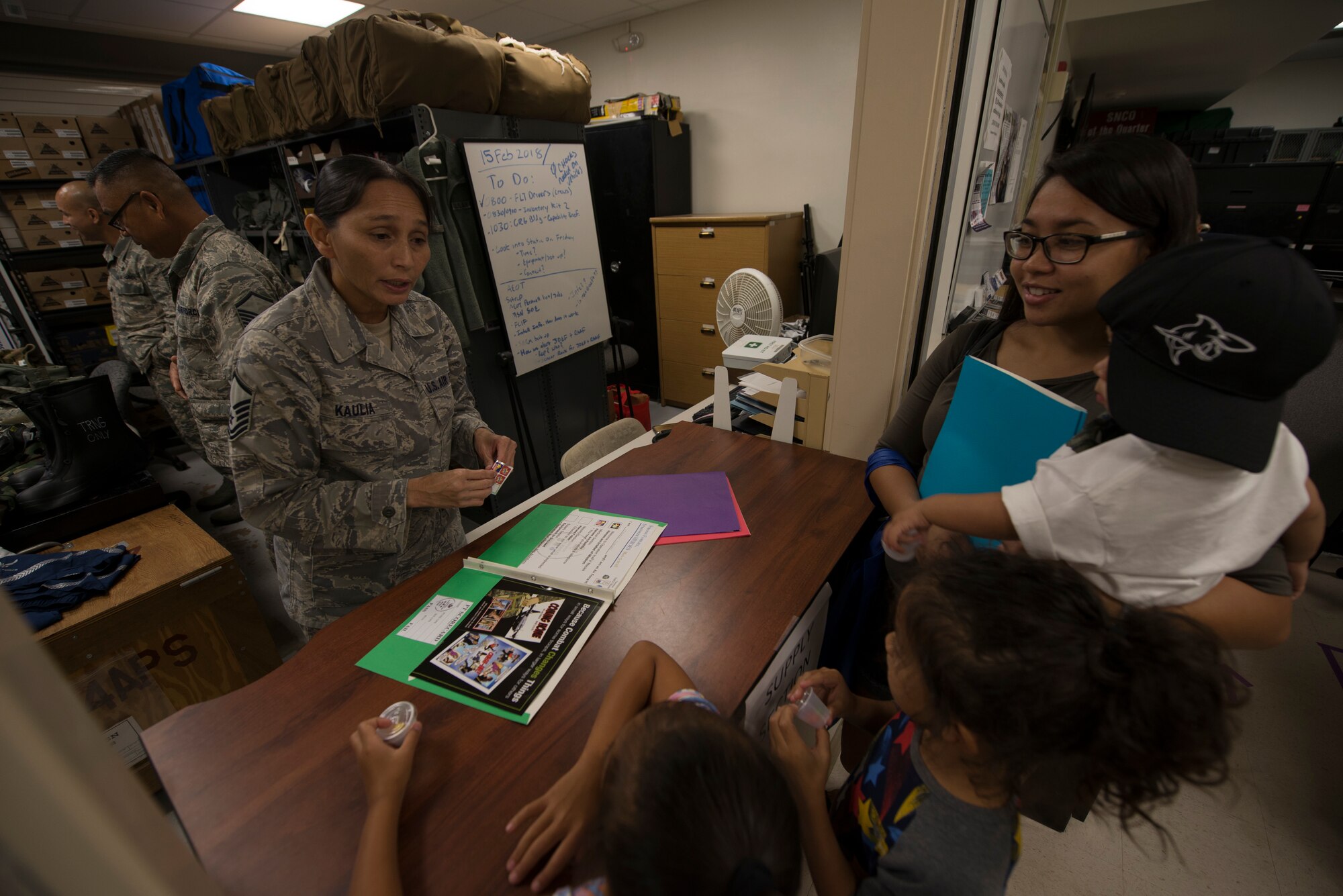 U.S. Air Force Master Sgt. Mary Kaulia, assigned to the U.S. Air Force Reserve’s 44th Aerial Port Squadron, introduces military children to readiness activities during Operation Inafa’ Maolek at Andersen Air Force Base, May 5, 2018.