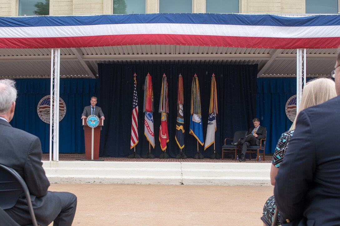 Deputy Defense Secretary Patrick M. Shanahan speaks from a podium at a ceremony.