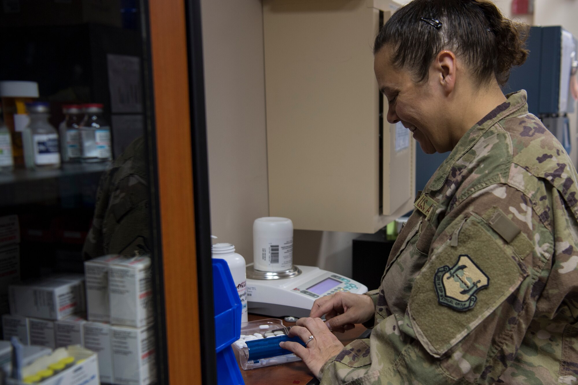 Lt. Col. Melissa Pammer, 386th Expeditionary Medical Group ancillary services element chief from Tinker Air Force Base, Okla., counts pills in the pharmacy at an undisclosed location in Southwest Asia, May 7, 2018. The pharmacy offers over-the-counter medications for many daily illnesses. (U.S. Air Force photo by Staff Sgt. Joshua King)