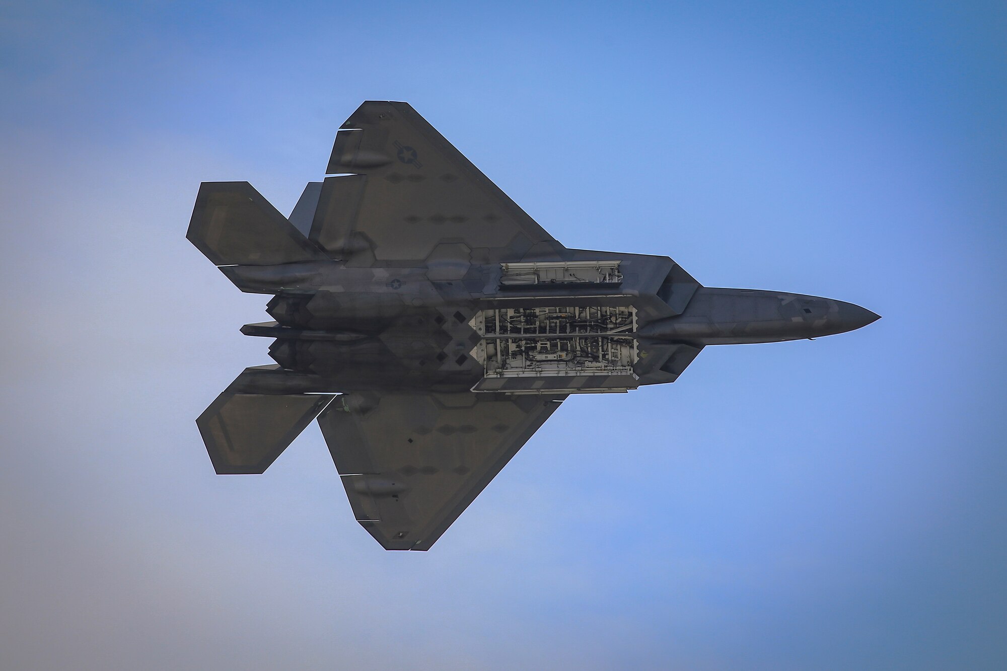 An F-22 Raptor piloted by Maj. Paul Lopez performs a single-ship demonstration at the 2018 Power in the Pines Open House and Air Show rehearsal held at Joint Base McGuire-Dix-Lakehurst, N.J., May 4, 2018. The F-22 Demo Team is based out of Joint Base Langley-Eustis, Va. (U.S. Air National Guard photo by Master Sgt. Matt Hecht)