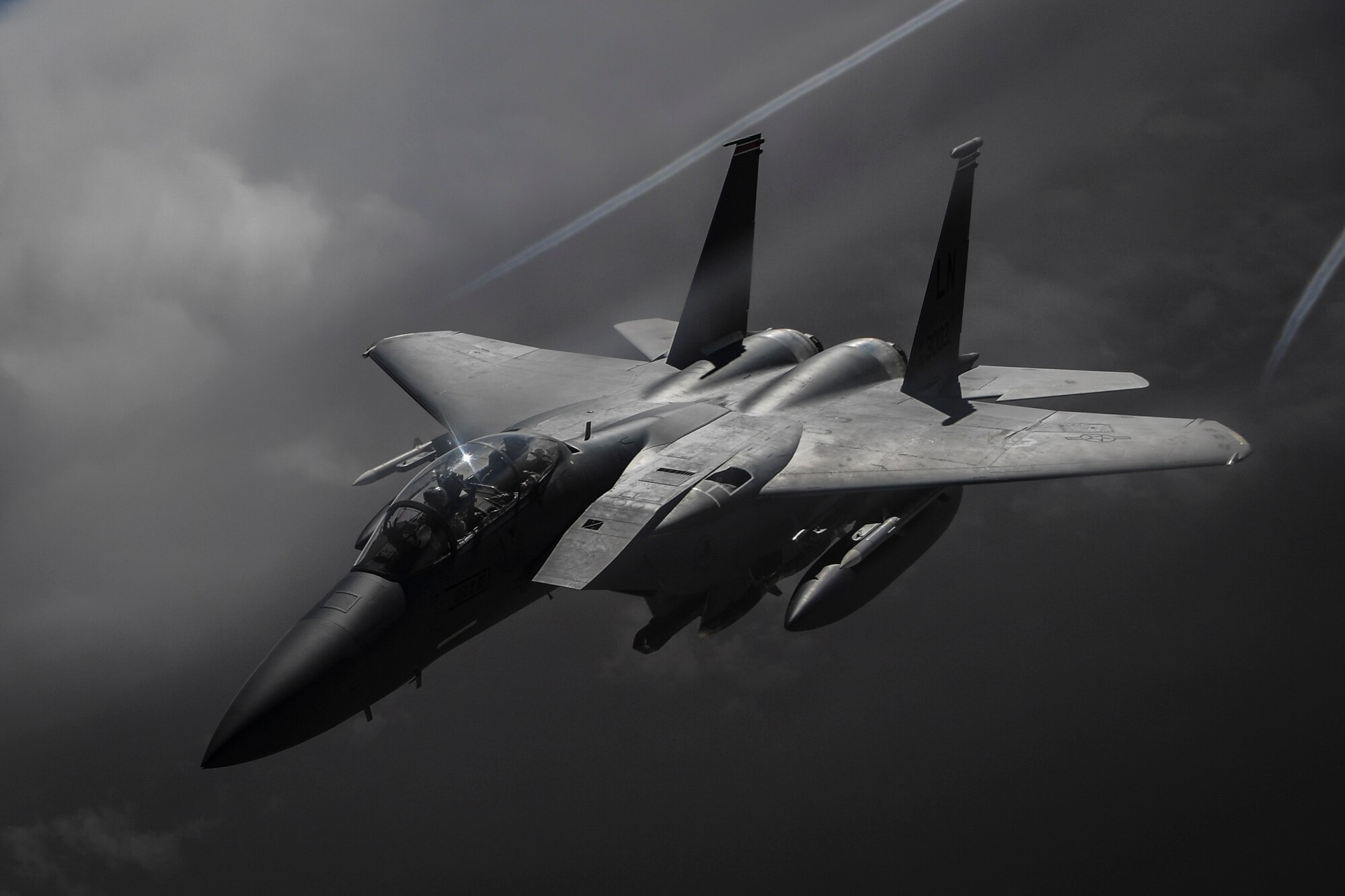 A U.S. Air Force F-15E Strike Eagle flies over Iraq on May 5, 2018. The F-15E is a dual-role fighter designed to perform air-to-air and air-to-ground missions. An array of avionics and electronics systems gives the F-15E the capability to fight at low altitude, day or night, and in all weather. (U.S. Air Force photo by Staff Sgt. Corey Hook)