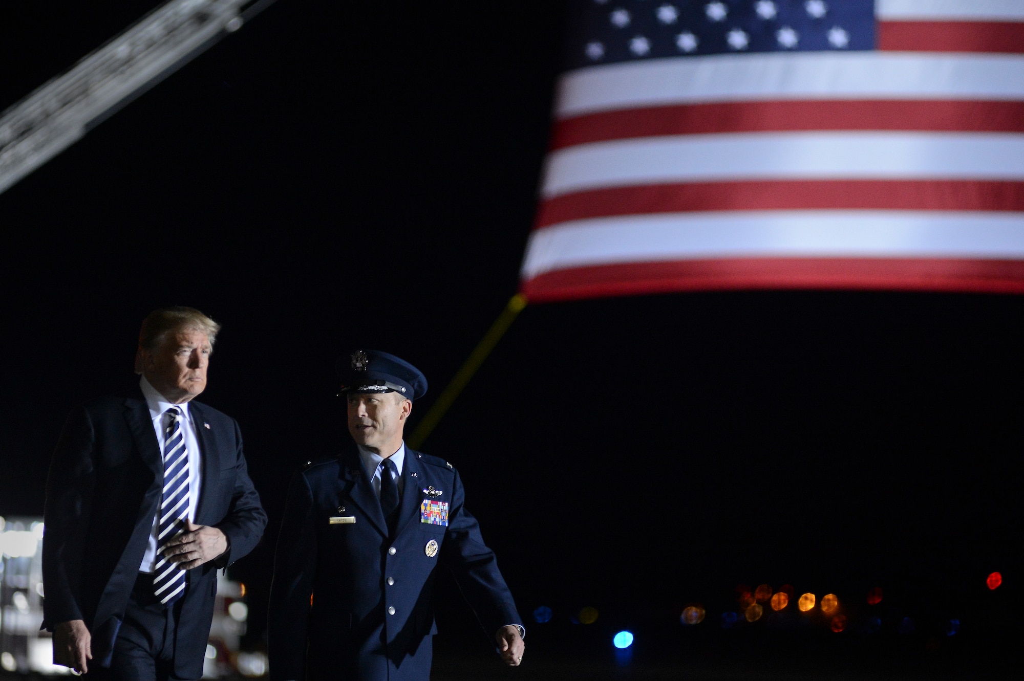 President of the United States Donald J. Trump walks with Col. Casey D. Eaton, 89th Airlift Wing commander at Joint Base Andrews, Md., May 10, 2018, as they prepare to greet three Americans who were freed from North Korea on May 9. An 89th AW C-40 high-priority personnel transport aircraft carried Kim Dong-chul, Tony Kim and Kim Hak-song from North Korea to Anchorage, Alaska, where the plane refueled before arriving at JB Andrews. The 89th AW executes special missions such as these on a routine basis while enabling national interests through global transportation for America's senior leaders. (U.S. Air Force photo by Staff Sgt. Kenny Holston)