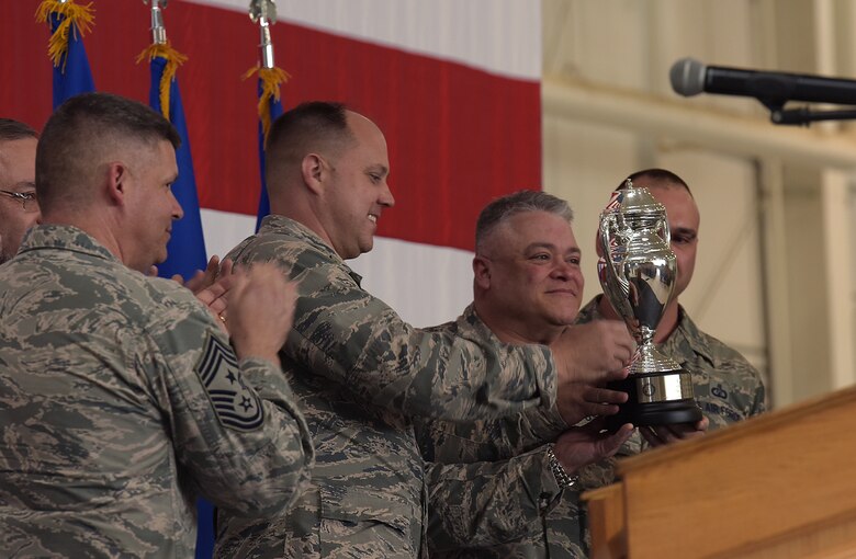 The 509th Bomb Wing and 131st Bomb Wing commanders hold up the Omaha Trophy during the award ceremony at Whiteman Air Force Base, Mo., May 8, 2018. The Omaha Trophy is awarded to units for excellence in strategic deterrence and global strike. Team Whiteman won the trophy for executing the best Strategic Bomber Operations of 2017.  (U.S. Air Force photos by Airman 1st Class Taylor Phifer)