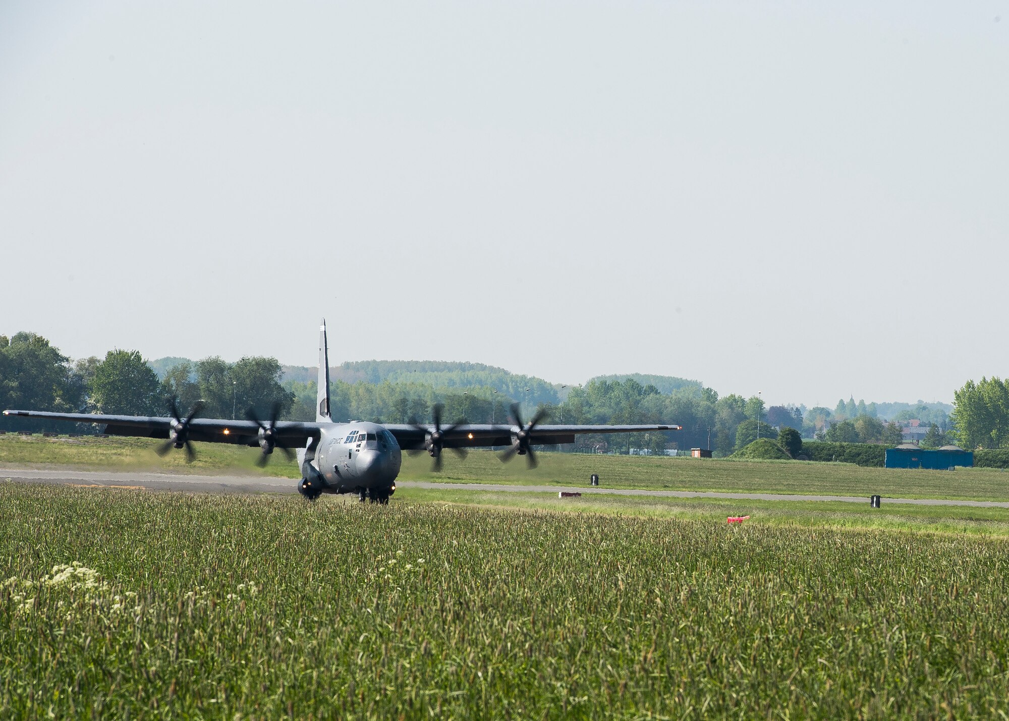 A C-130J Super Hercules from Ramstein Air Base, Germany lands on a new landing zone at Chievres Air Base, Belgium, May 4, 2018. Members of the 37th Airlift Squadron and 435th Contingency Response Group were testing and surveying the new landing zone’s integrity before opening it for future use. (U.S. Air Force photo by Staff Sgt. Jimmie D. Pike)