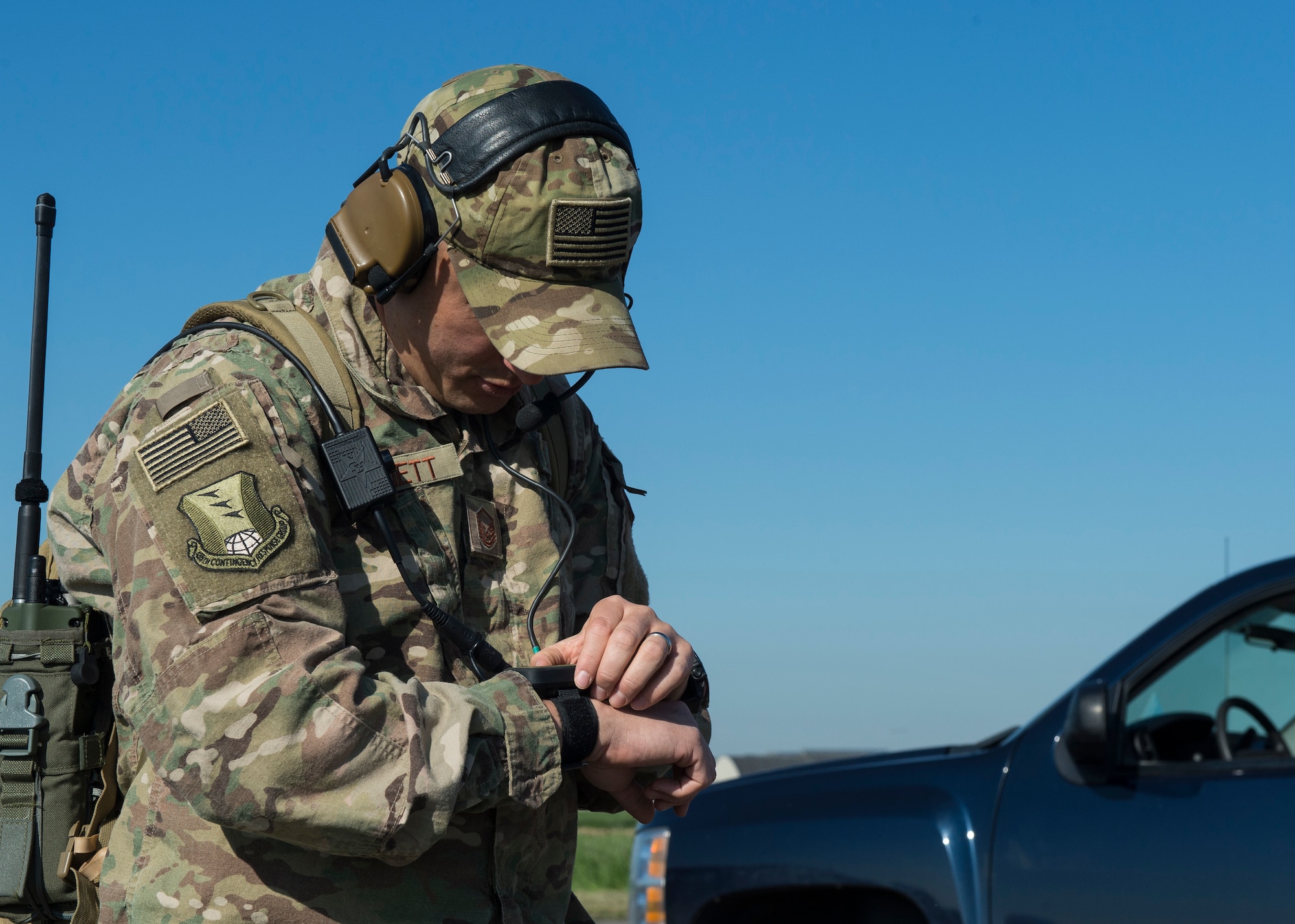 U.S. Air Force Master Sgt. Benjamin Barnett, 435th Contingency Response Squadron Operations Flight superintendent, checks coordinates for landing zone spacing at Chievres Air Base, Belgium, May 4, 2018. Coordinates were set to mark the beginning and the end of the runway to ensure proper distance for landings and take-offs. (U.S. Air Force photo by Staff Sgt. Jimmie D. Pike)