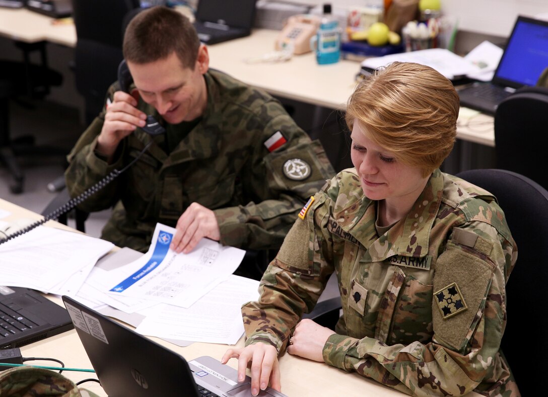 U.S. Army Spc. Maegen Palmer and Polish Army Maj. Piotr Gadawski,