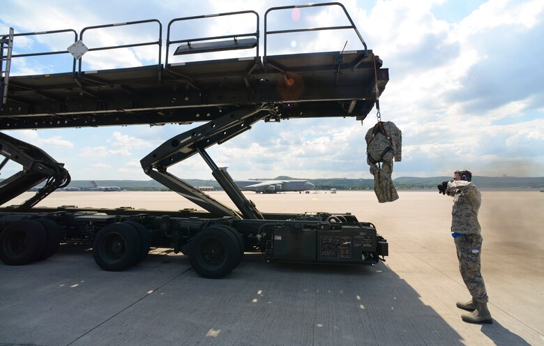 U.S. Air Force Airman 1st Class Kyle Renner, 721st Ariel Port Squadron ramp services specialist, recovers a dummy during a demonstration for National Institute for Occupational Safety and Health officials May 9, 2018, on Ramstein Air Base, Germany. During fall incidents service members have approximately six minutes to respond to the victim before the blood in extremities becomes deoxygenated which is harmful to the heart and brain upon return. (U.S. Air Force photo by Airman 1st Class D. Blake Browning)