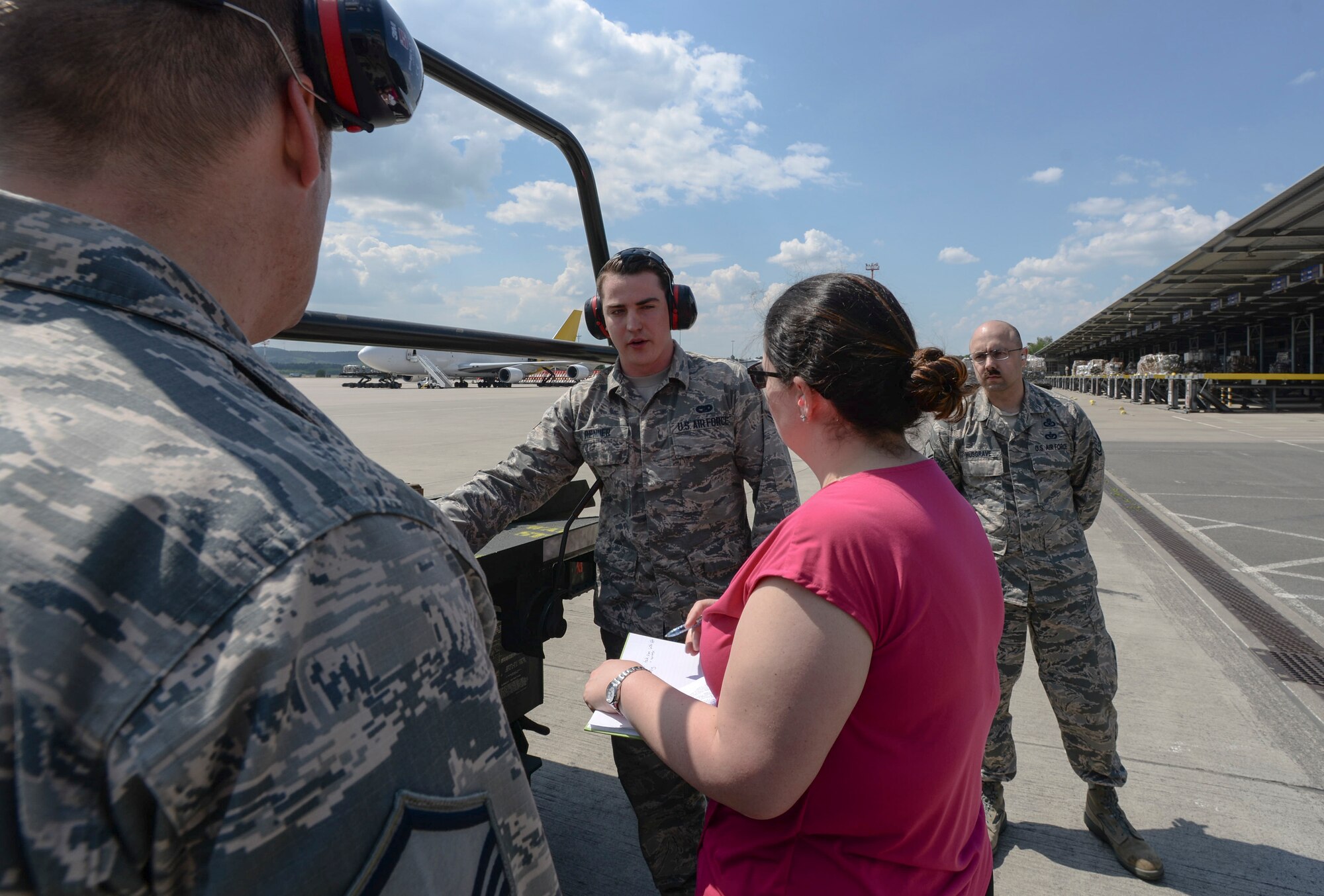 U.S. Air Force Airman 1st Class Kyle Renner, 721st Ariel Port Squadron ramp services specialist, briefs a National Institute for Occupational Safety and Health official during a demonstration May 9, 2018, on Ramstein Air Base, Germany. The bi-annual demonstrations aim to reemphasize the importance of fall protection for service members. (U.S. Air Force photo by Airman 1st Class D. Blake Browning)
