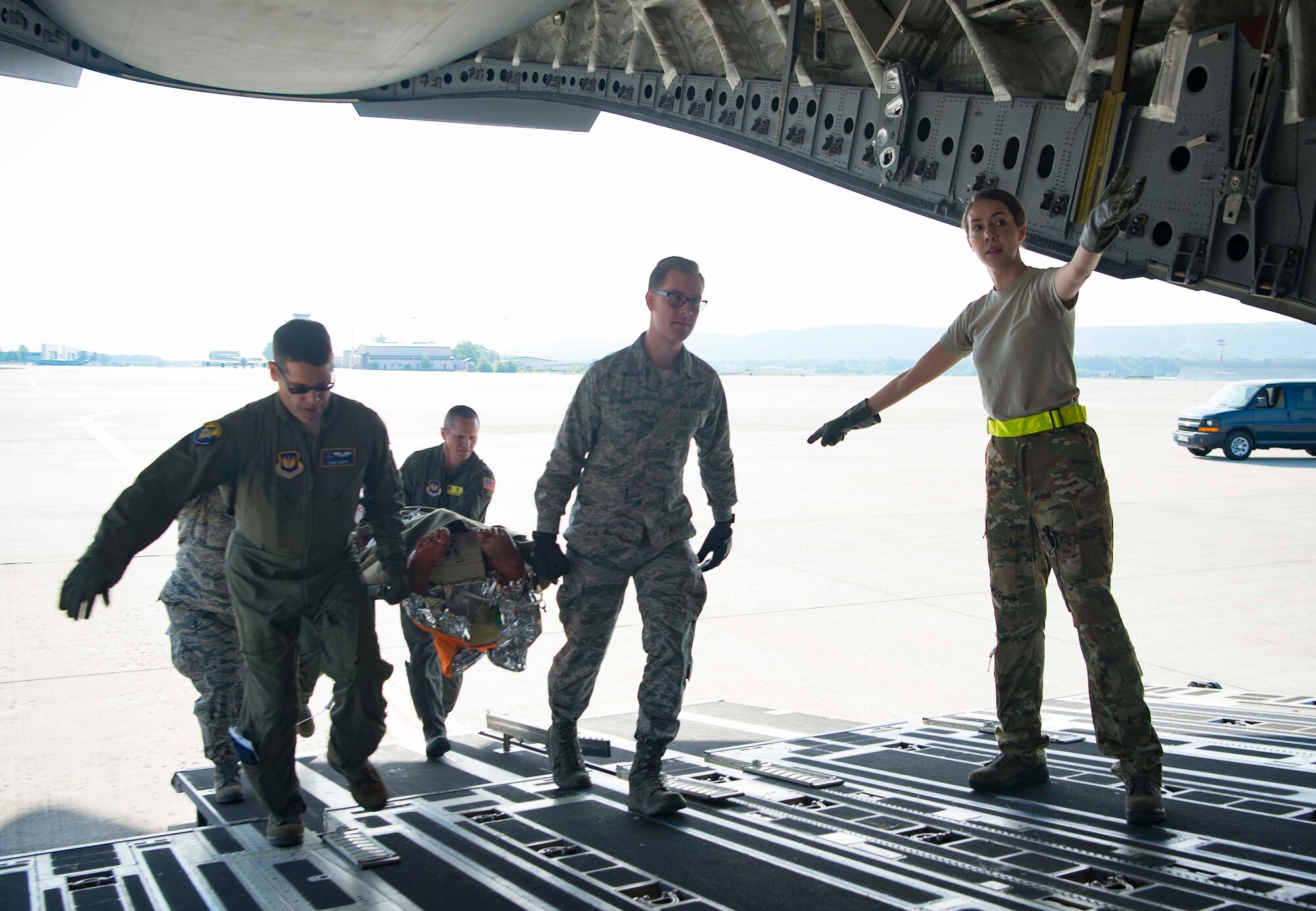 86th Medical Squadron Critical Care Air Transport Team Airman move a simulated burn victim onto a C-5 Galaxy during a burn victim evacuation exercise on Ramstein Air Base, Germany, May 9, 2018. The 86th Medical Squadron is a high-paced squadron that trains constantly and is ready to respond any moment, day or night, to save lives across Europe and Africa. (U.S. Air Force photo by Senior Airman Elizabeth Baker)