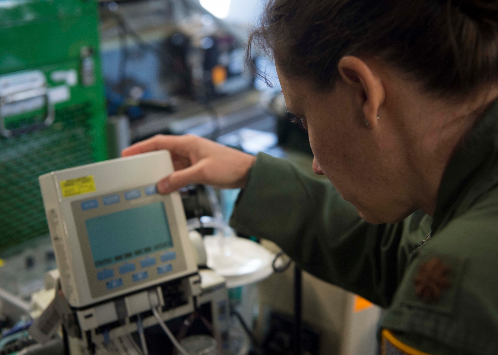 A 86th Critical Care Air Transport Team Airman assembles equipment to use on a simulated critical care patient on Ramstein Air Base, Germany, May 9, 2018. The 86th Medical Squadron brought together the Aeromedical Evacuation Squadron, CCAT, and En-Route Patient Staging Flight to each play their parts in a burn victim evacuation exercise. (U.S. Air Force photo by Senior Airman Elizabeth Baker)