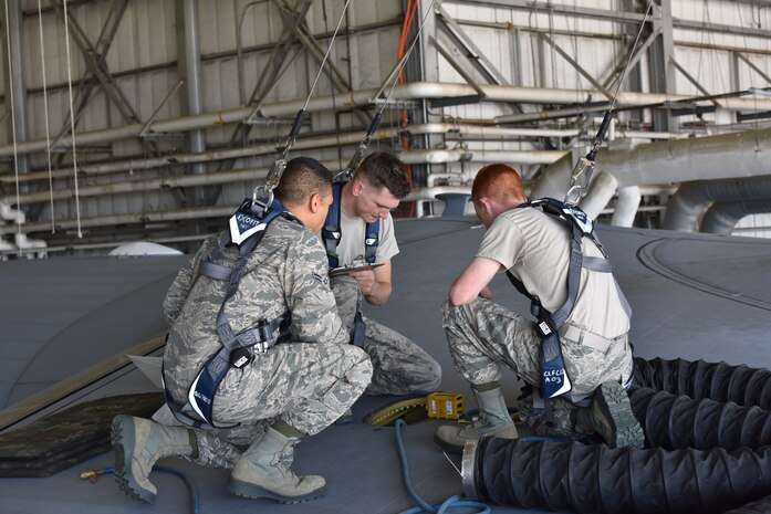 Airman 1st Class Brandon Chapman, left, 437th Maintenance Squadron Aircraft fuel System journeyman, Airman 1st Class Bryce Pfalzer, center, 437th MXS Aircraft fuel System journeyman, and Airman 1st Class Jared Trabert, right, 437th MXS Aircraft fuel System journeyman, wear the proper fall protection during training May 8, 2018, in the Aircraft Fuel System building at Joint Base Charleston, S.C. There are many variables involved in a fall that are outside of a worker’s control, such as working conditions, the specific job site, and human error. Wearing the proper PPE helps to prevent and reduce as many accidents as possible.