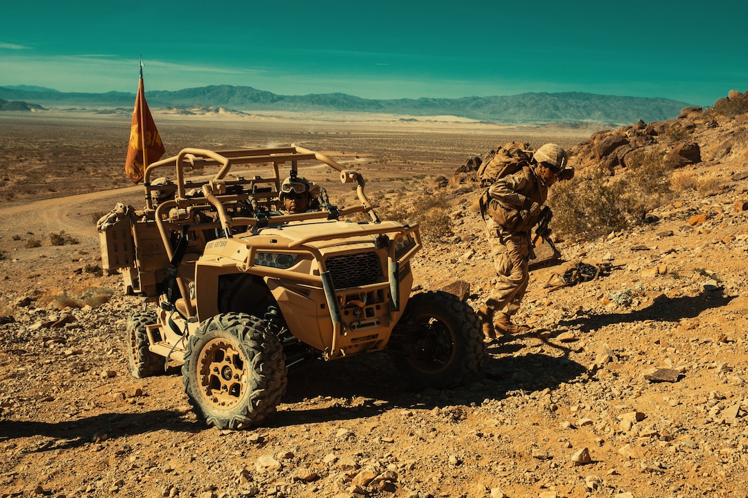 A Marine with 3rd Battalion, 4th Marines, 7th Marine Regiment, 1st Marine Division, runs to deliver ammunition to his fellow Marines at Range 400 during Integrated Training Exercise 3-18 aboard the Marine Corps Air Ground Combat Center, Twentynine Palms, Calif., May 7, 2018. The purpose of ITX is to create a challenging, realistic training environment that produces combat-ready forces capable of operating as an integrated Marine Air Ground Task Force. (U.S. Marine Corps photo by Lance Cpl. Isaac Cantrell)