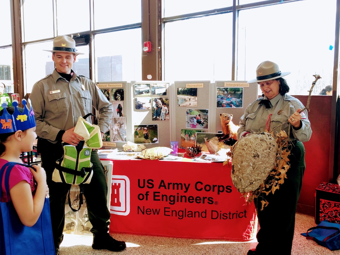 West Hill Dam Park Rangers Ron Woodall and Viola Bramel speak to a student during a local fair.  West Hill Dam Junior Rangers who visit Corps Educational Booths or attend interpretative programs at the dam receive credit towards graduation.